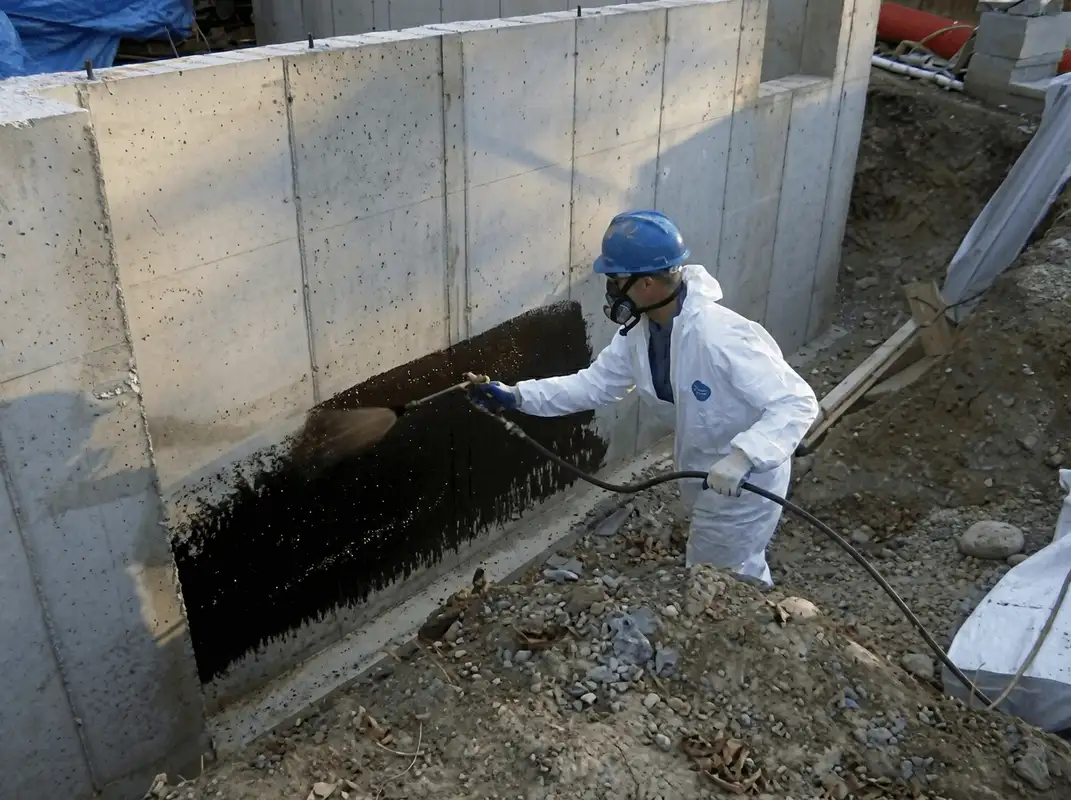 Professional waterproofing the exterior walls of the basement in Marietta, GA