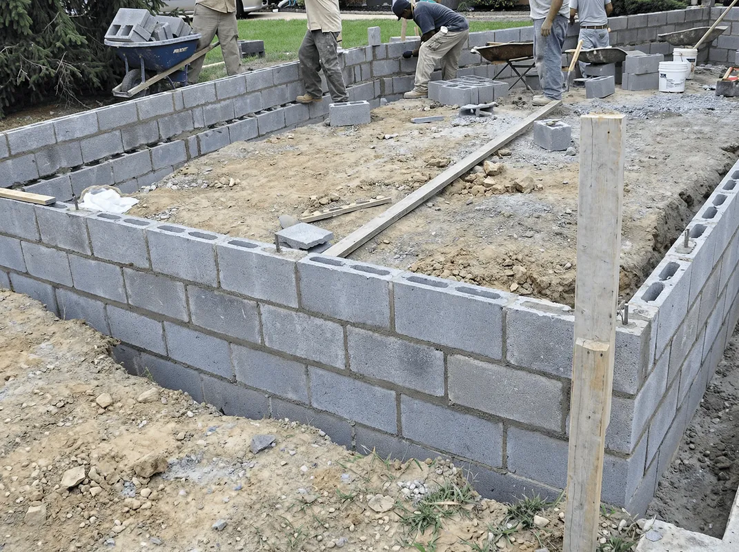 Professionals building a foundation with blocks in Marietta, GA